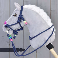 Grey Hobby Horse with brown eyes wearing the Rope set Rosemary, a navy rope halter and reins with neon rainbow wraps