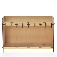 Stable for 3 Hobby Horses seen from the front, an open plywood rack with hooks and three round holes top and bottom