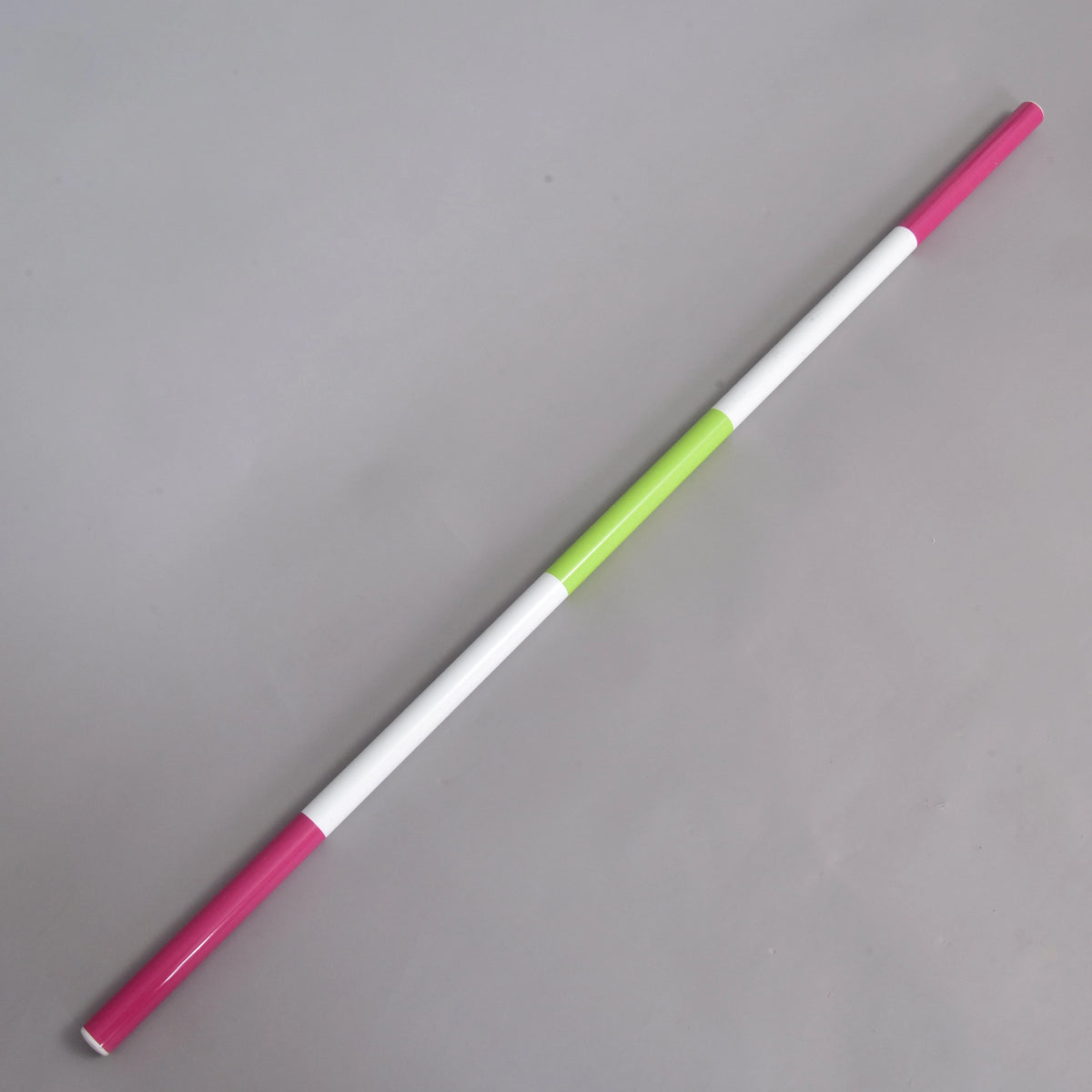 LarDen Hobby Horse Jump pole pink-green with pink ends, long white sections and a lime green middle, on a grey floor