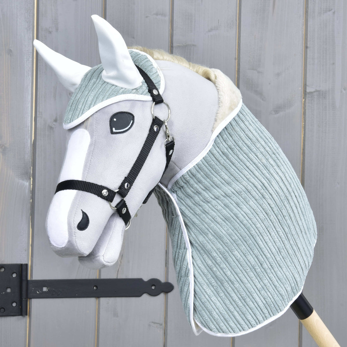 Light grey Hobby Horse in a black halter wearing the Set Manchester Little Green with white satin ears and white trim