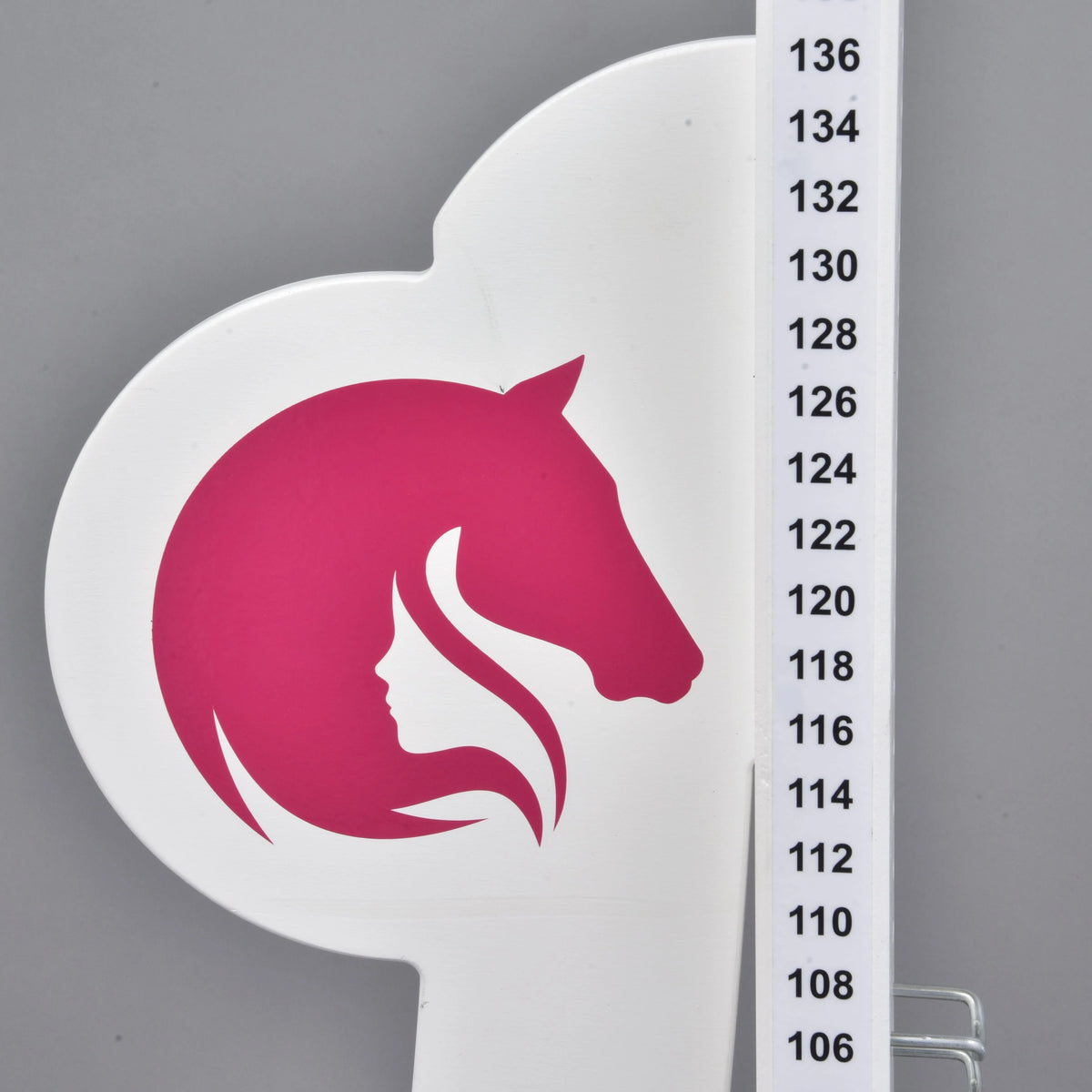 The opposite wing with the mirrored pink logo on the left of the post, height marks from 106 to 136 cm in 2 cm steps