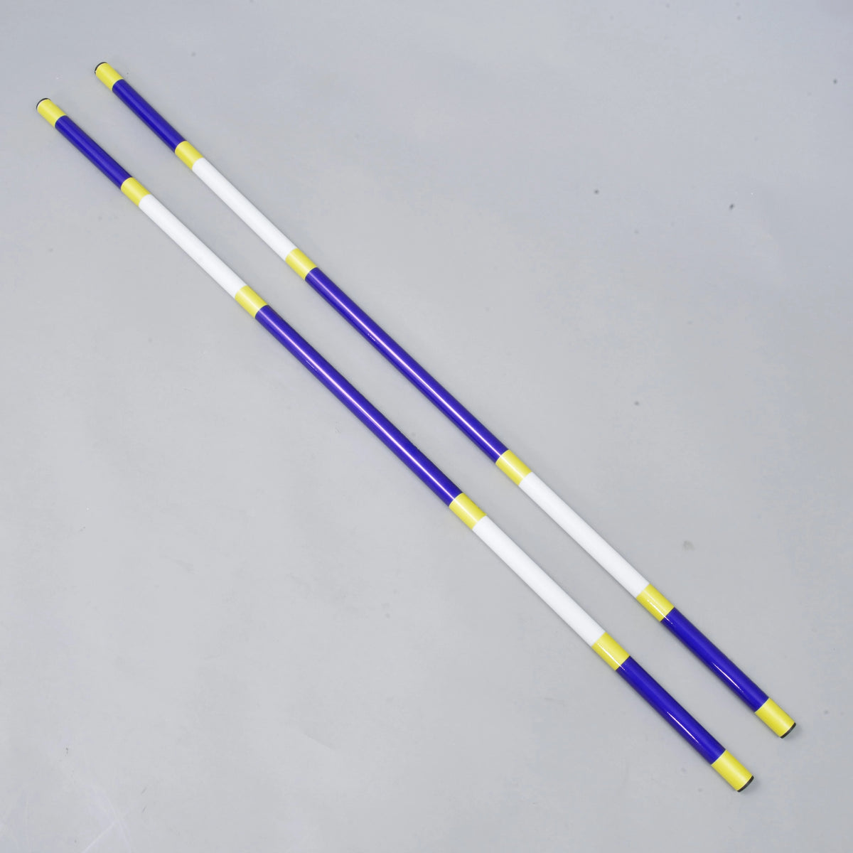 LarDen Hobby Horse Jump pole blue-white, 2 pcs: two blue and white poles with yellow bands, lying side by side