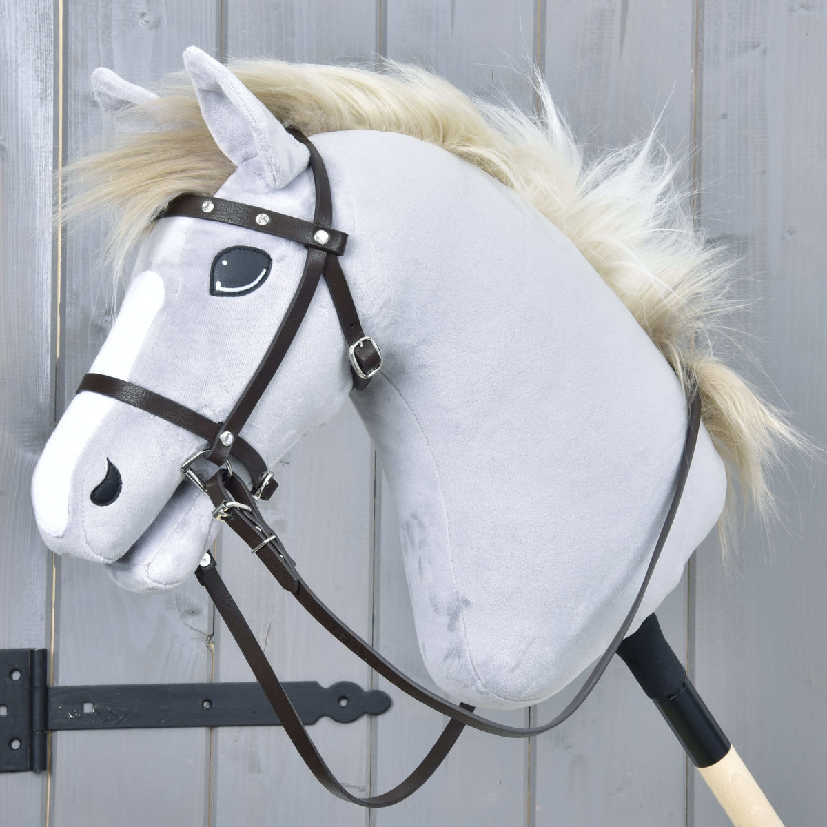 LarDen Hobby Horse Complete brown bridle with diamonds from leatherette with reins on a grey plush horse with a cream mane