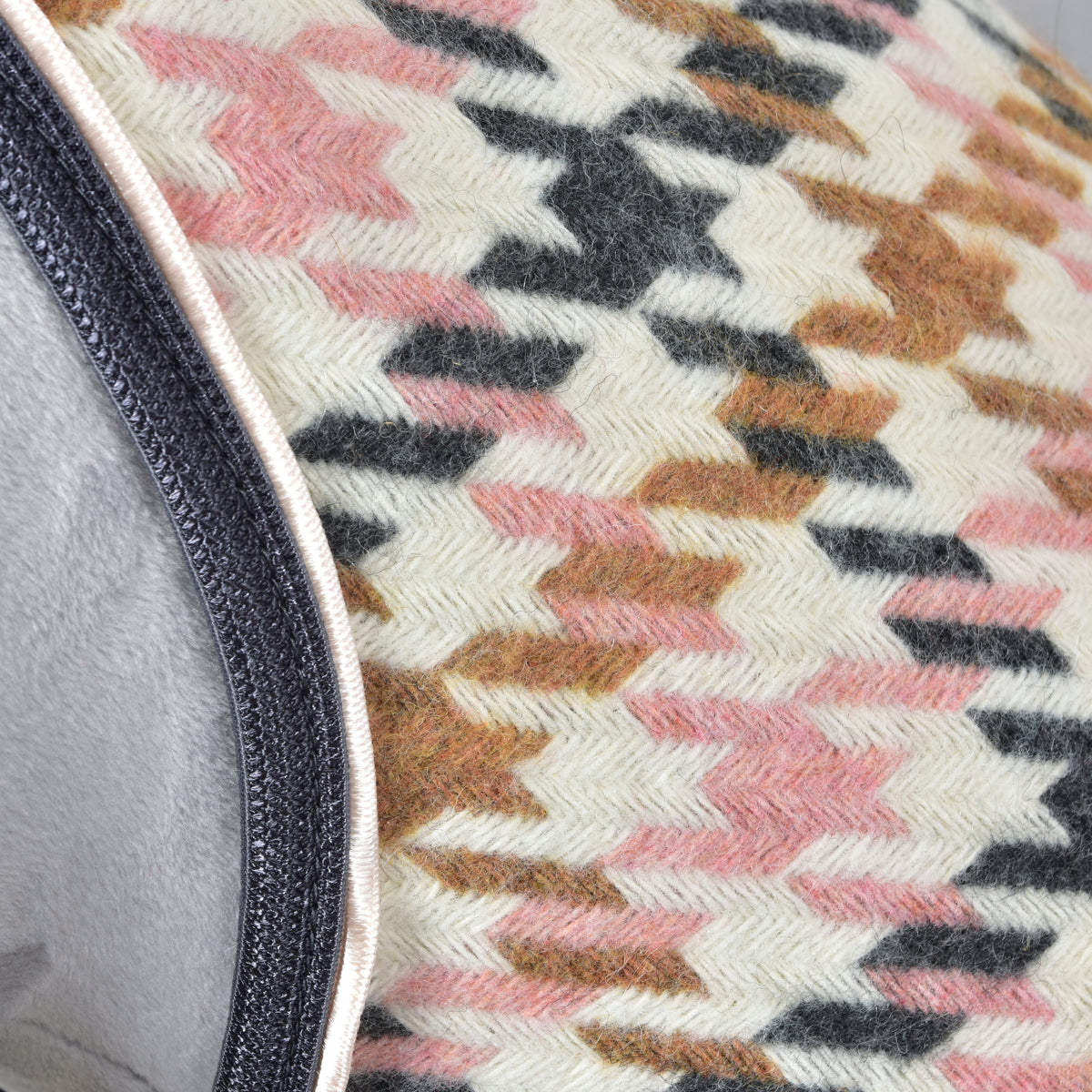 Hobby Horse Stable Blanket Country Rose close-up of the pink, caramel and charcoal houndstooth weave with dark edge binding