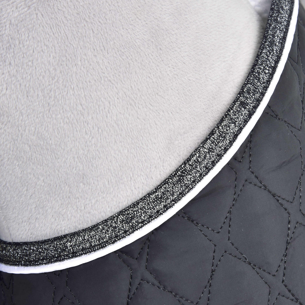 Close-up of the Hobby Horse Set Thermo Black Queen neckline with sparkly silver trim and white piping