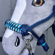 Close-up of the navy rope halter on a grey Hobby Horse with a turquoise, black and cream braided noseband and a snap hook