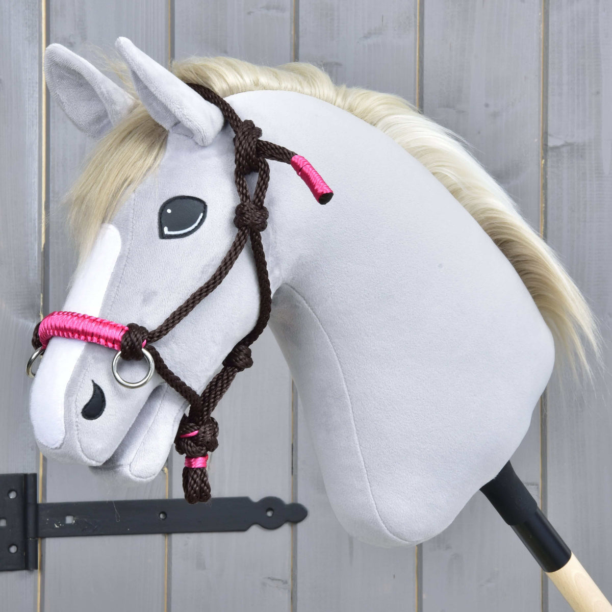 Grey Hobby Horse in the dark brown rope halter from Rope set Noir Cocoa, with a pink wrapped noseband and knots on the cheek