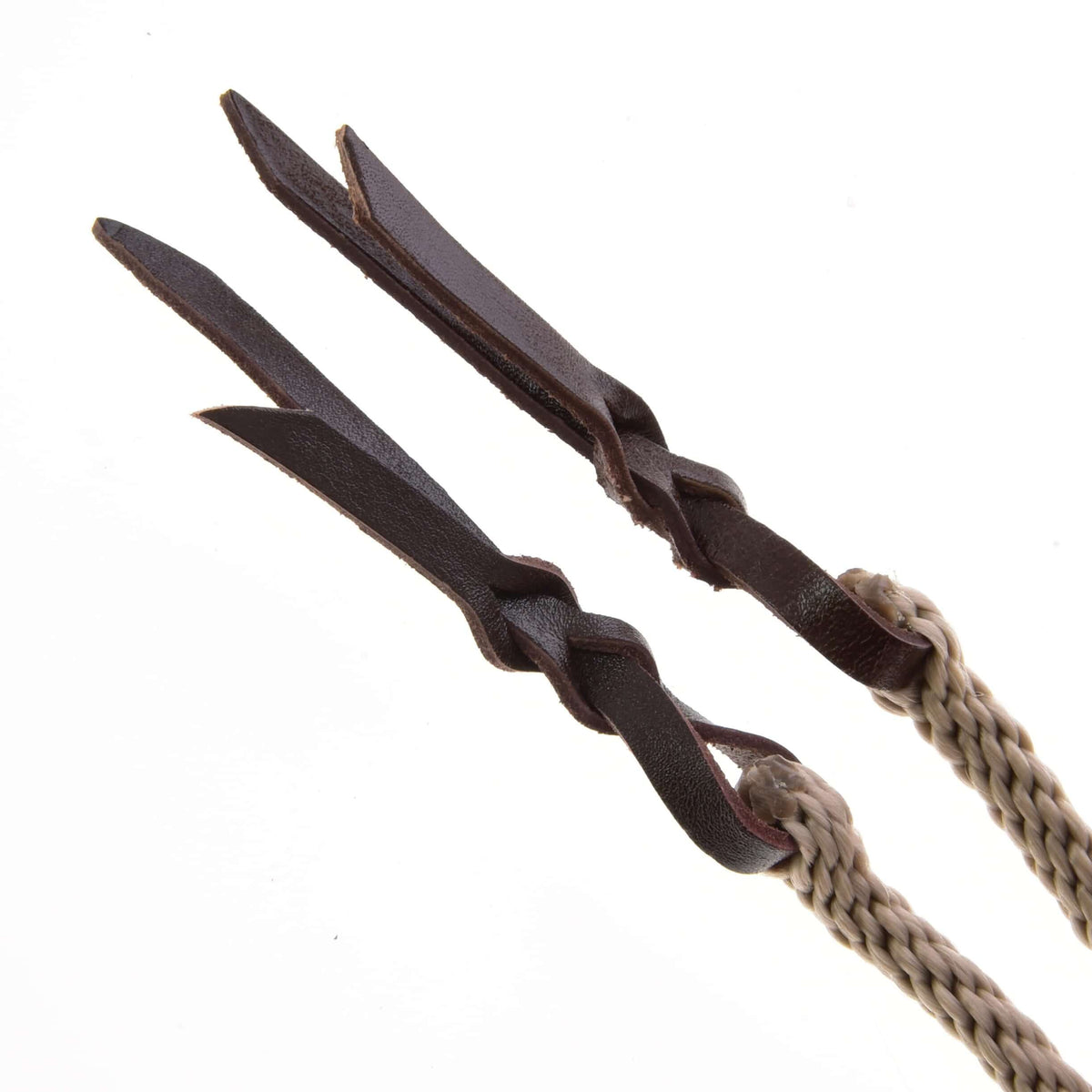 Close-up of the two rein ends, dark brown leather strips knotted onto the beige braided rope