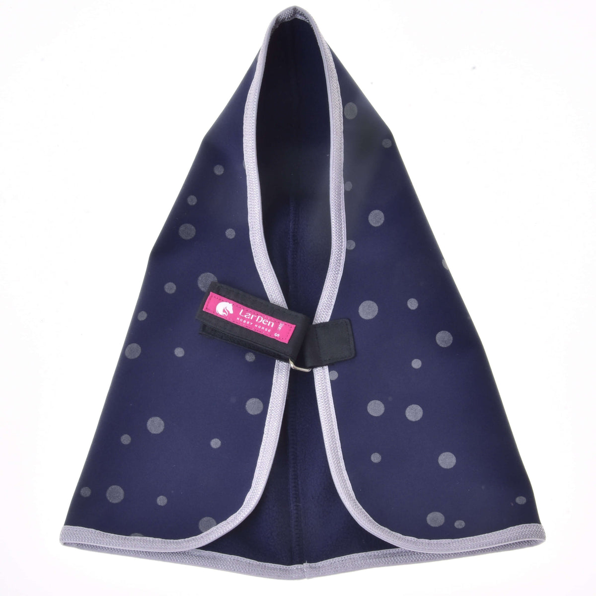 Navy dotted stable blanket opened out at the neck, showing the black chest strap with its pink LarDen label