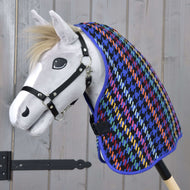 Grey Hobby Horse with a blond mane and black halter wearing the bright houndstooth Stable Blanket Peru over its neck