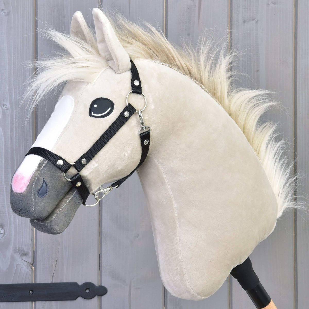 Hobby Horse Pixie with Black Halter by LarDen, a cream plush head with a white blaze, grey muzzle and flowing pale fur mane