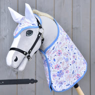 Light grey Hobby Horse with a black halter in the floral blanket and matching ear bonnet with white ears and blue trim