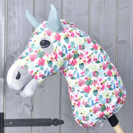 Hobby Horse protective suit LarDen Star (Lycra) on a grey head, white tropical print with pink flowers and sage green ears