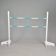 LarDen Hobby Horse Jump with two turquoise and white poles on white wooden stands with a height scale up to 120 cm