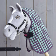 Grey Hobby Horse with brown eyes and a black halter wearing the Stable Blanket Green in mint and purple houndstooth