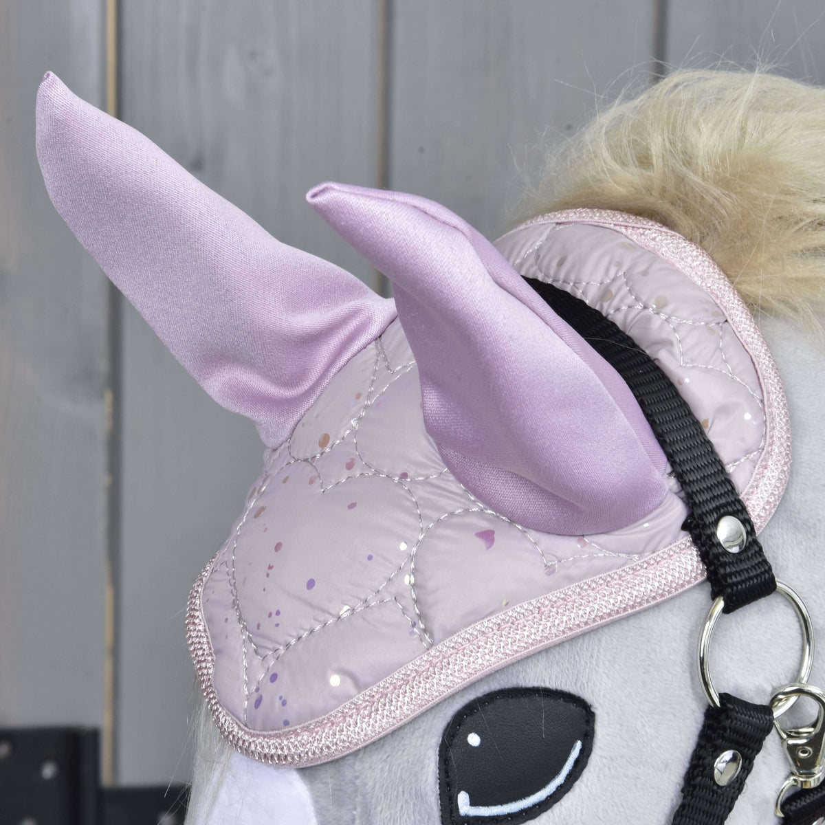 Close-up of the Sweetest Heart ear bonnet with lilac satin ears, heart quilting and glittery pink binding
